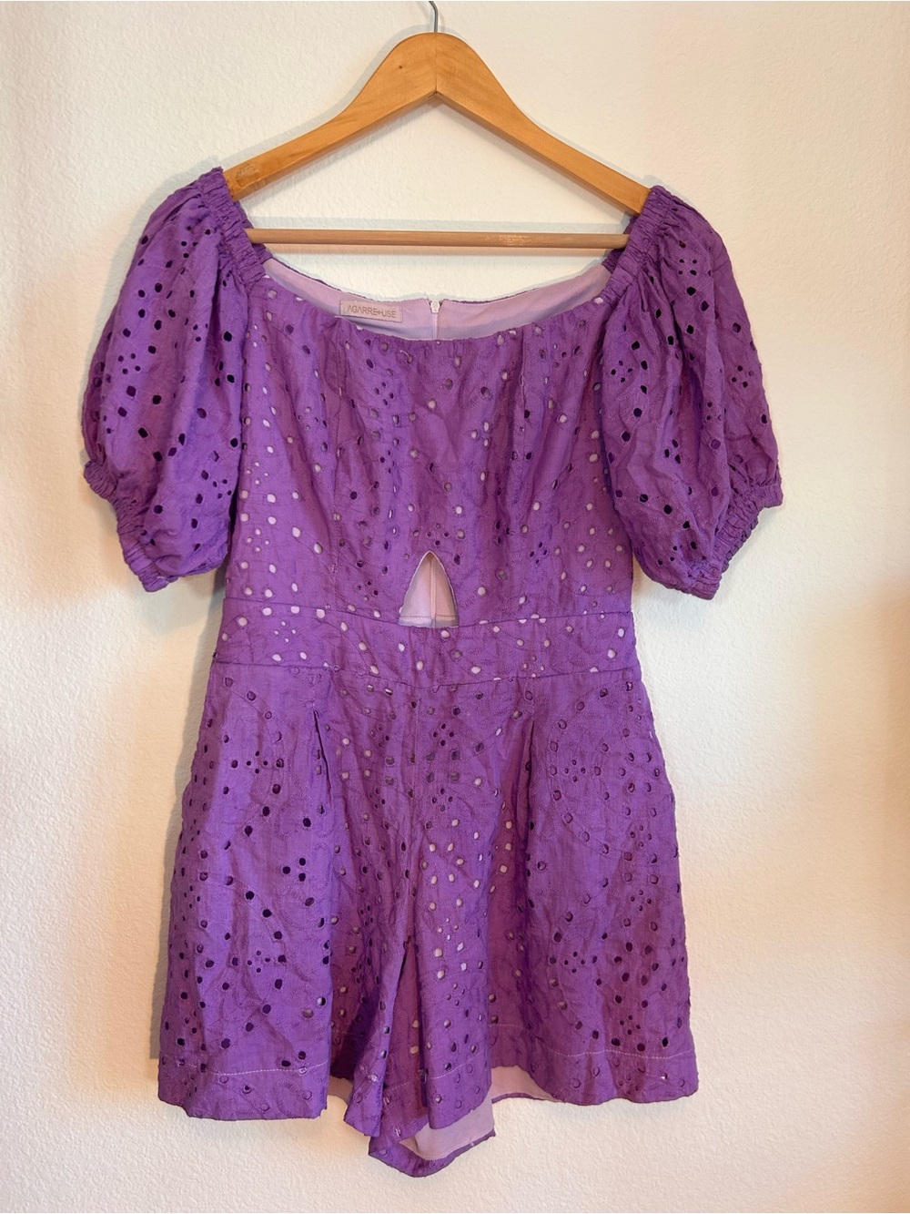 Purple eyelet romper.